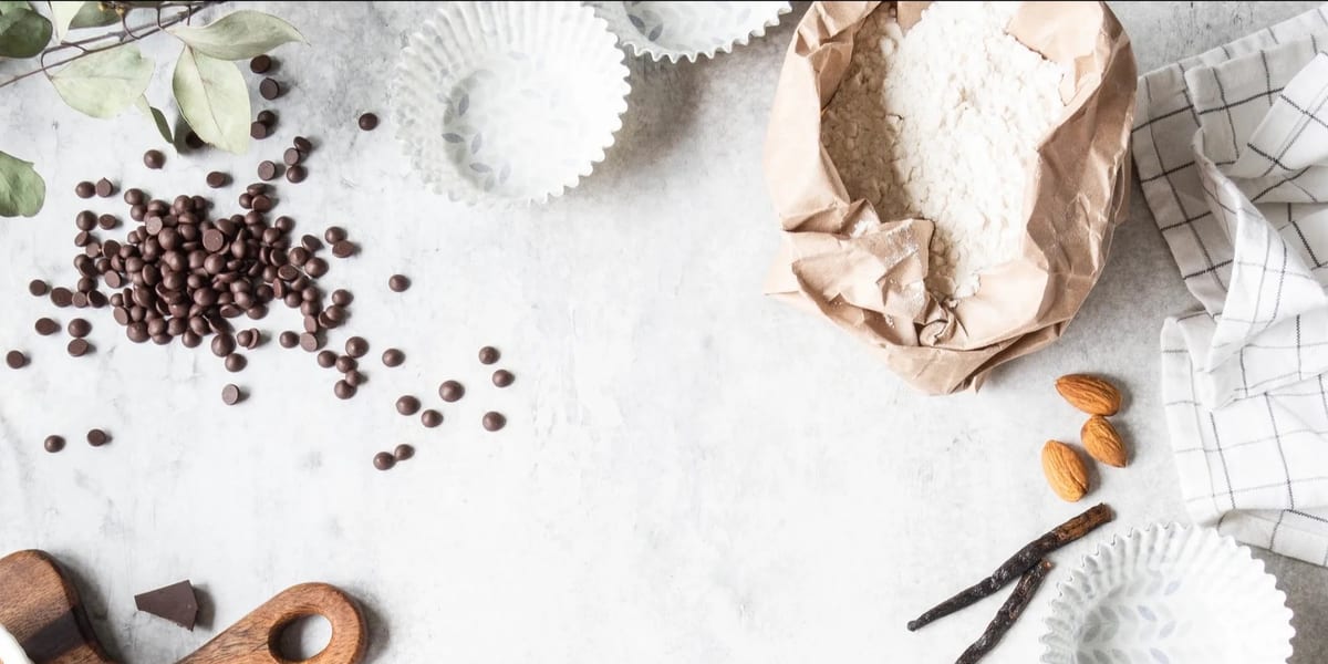 Fresh baking ingredients laid out on a surface